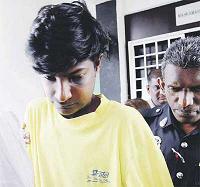 R. Narayanan being escorted from the Klang magistrate’s court yesterday. — NST picture by Roslin Mat Tahir 