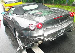 The lone Ferrari Spyder spun out of control and crashed on Friday while being chased by thugs on the North-South Highway. -- PHOTO: SIN CHEW DAILY